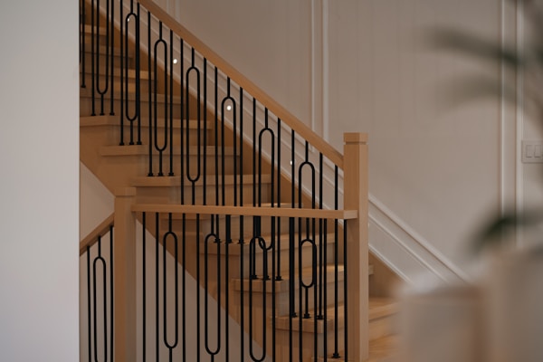 Finished basement with modern staircase